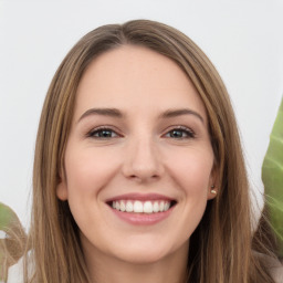 Joyful white young-adult female with long  brown hair and green eyes