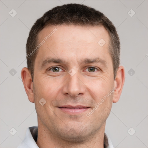 Joyful white adult male with short  brown hair and grey eyes