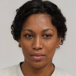 Neutral black young-adult female with short  brown hair and brown eyes