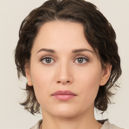 Neutral white young-adult female with medium  brown hair and green eyes