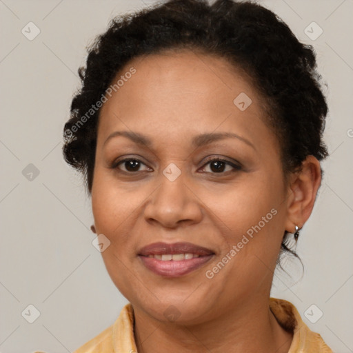 Joyful latino adult female with medium  brown hair and brown eyes