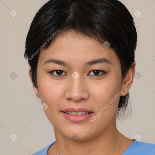 Joyful asian young-adult female with short  brown hair and brown eyes