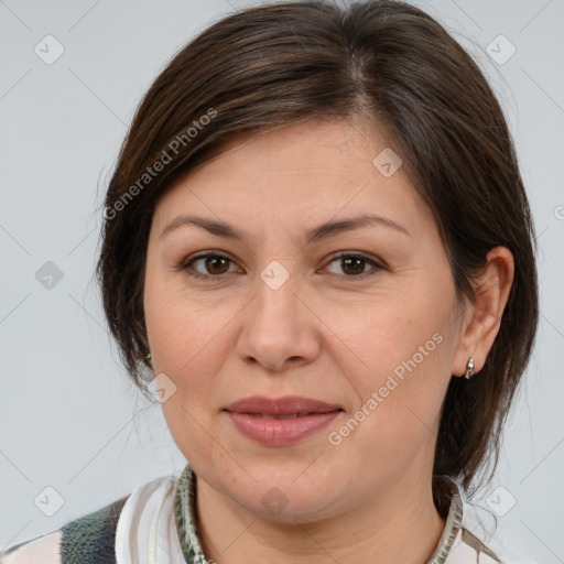 Joyful white adult female with medium  brown hair and brown eyes