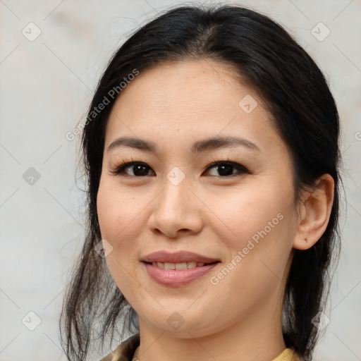 Joyful asian young-adult female with medium  brown hair and brown eyes