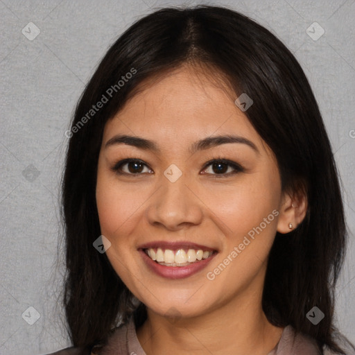 Joyful asian young-adult female with long  brown hair and brown eyes