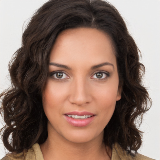 Joyful white young-adult female with long  brown hair and brown eyes