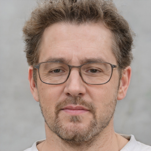 Neutral white middle-aged male with short  brown hair and brown eyes