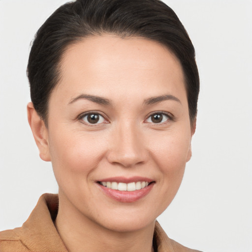 Joyful white young-adult female with short  brown hair and brown eyes