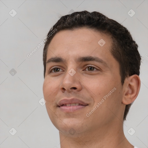 Joyful white young-adult male with short  brown hair and brown eyes