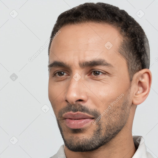 Neutral white young-adult male with short  black hair and brown eyes