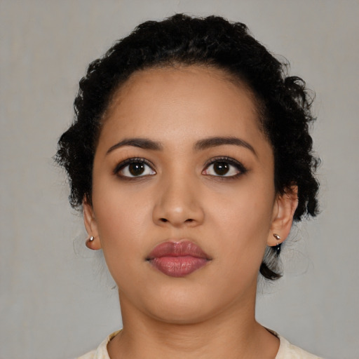 Neutral latino young-adult female with medium  black hair and brown eyes
