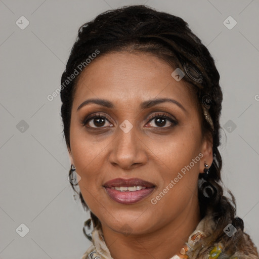 Joyful black adult female with medium  brown hair and brown eyes