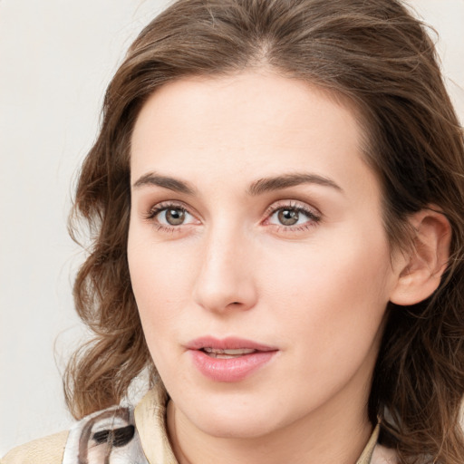 Neutral white young-adult female with long  brown hair and green eyes