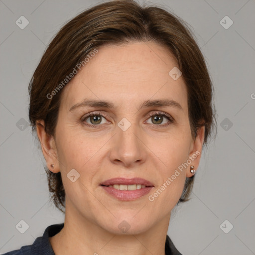 Joyful white adult female with medium  brown hair and grey eyes