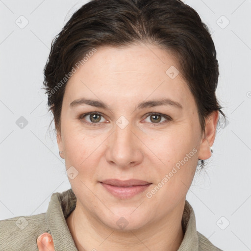 Joyful white adult female with medium  brown hair and grey eyes