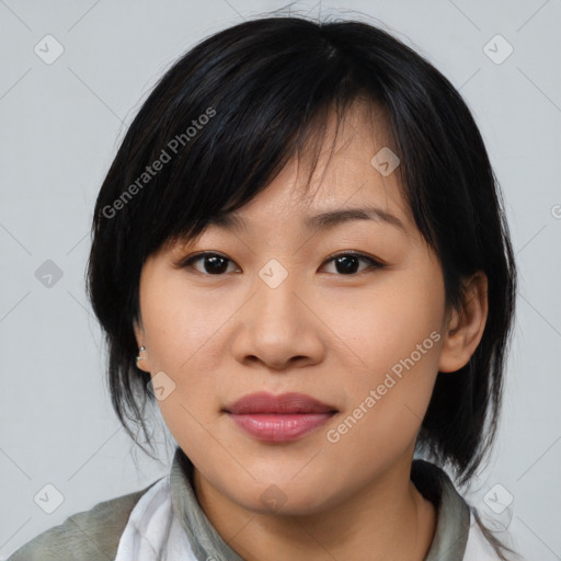 Joyful asian young-adult female with medium  black hair and brown eyes