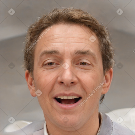 Joyful white middle-aged male with short  brown hair and brown eyes