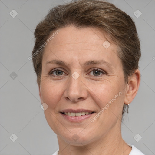 Joyful white adult female with short  brown hair and brown eyes