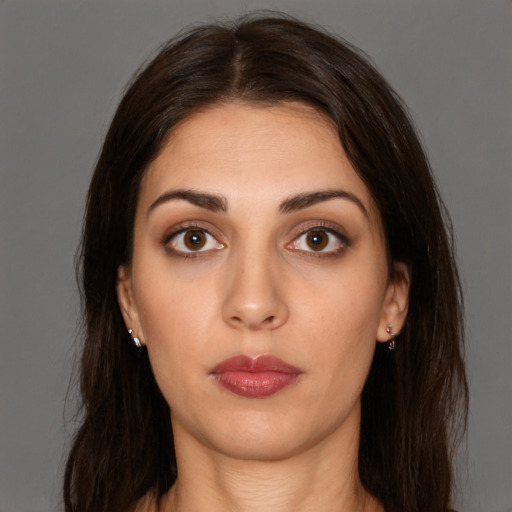 Neutral white young-adult female with long  brown hair and brown eyes