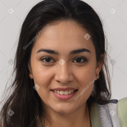 Joyful latino young-adult female with long  brown hair and brown eyes