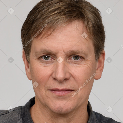 Joyful white adult male with short  brown hair and grey eyes