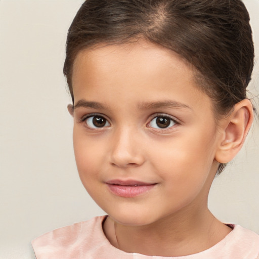 Joyful white child female with short  brown hair and brown eyes