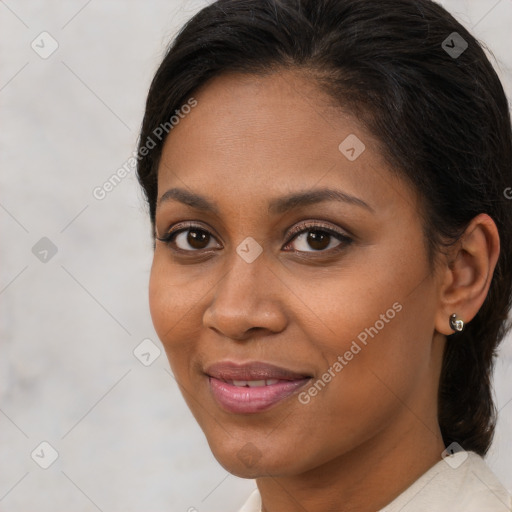 Joyful black young-adult female with medium  brown hair and brown eyes