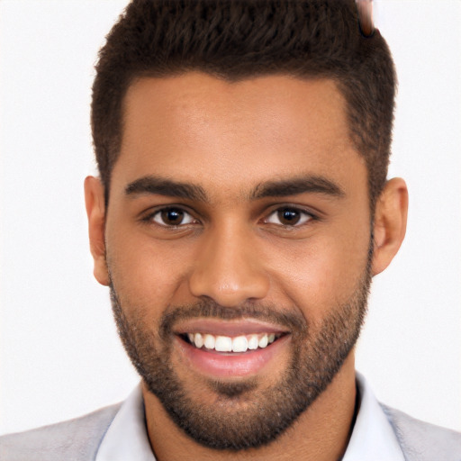 Joyful white young-adult male with short  brown hair and brown eyes