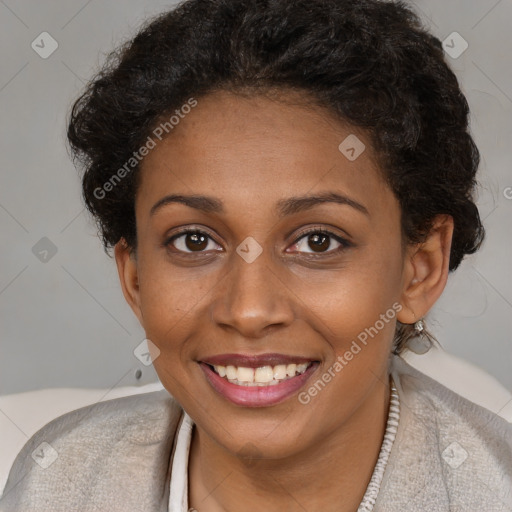 Joyful black young-adult female with short  brown hair and brown eyes