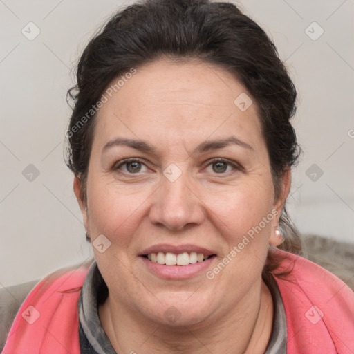 Joyful white adult female with medium  brown hair and grey eyes