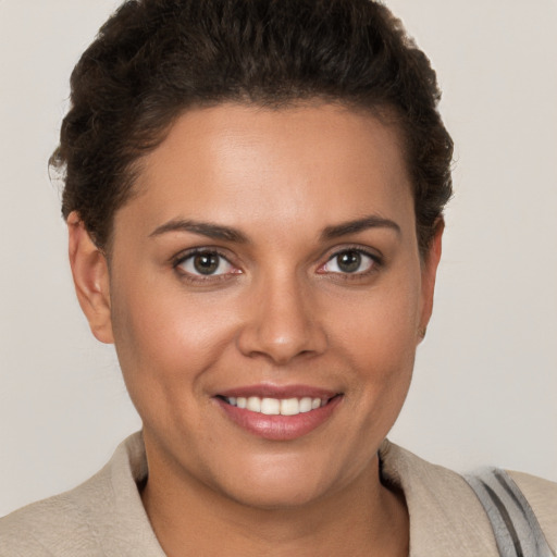 Joyful white young-adult female with short  brown hair and brown eyes