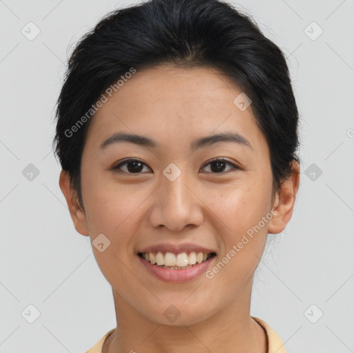 Joyful asian young-adult female with short  brown hair and brown eyes