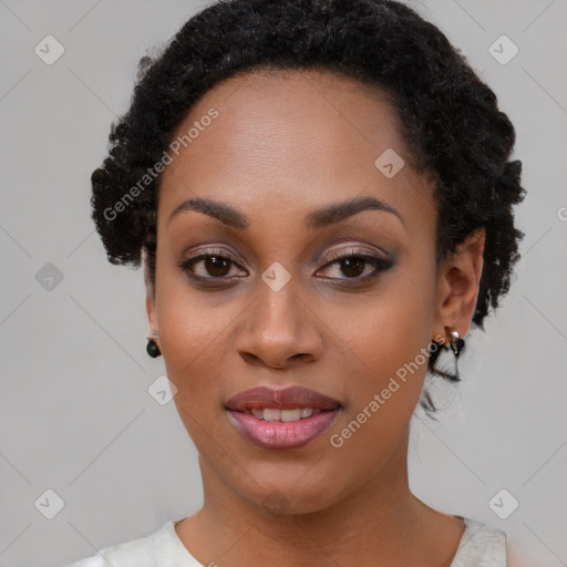 Joyful black young-adult female with short  black hair and brown eyes