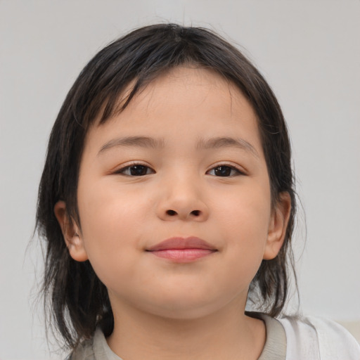 Joyful asian child female with medium  brown hair and brown eyes