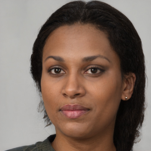 Neutral black young-adult female with long  black hair and brown eyes