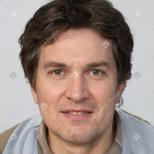 Joyful white adult male with short  brown hair and grey eyes