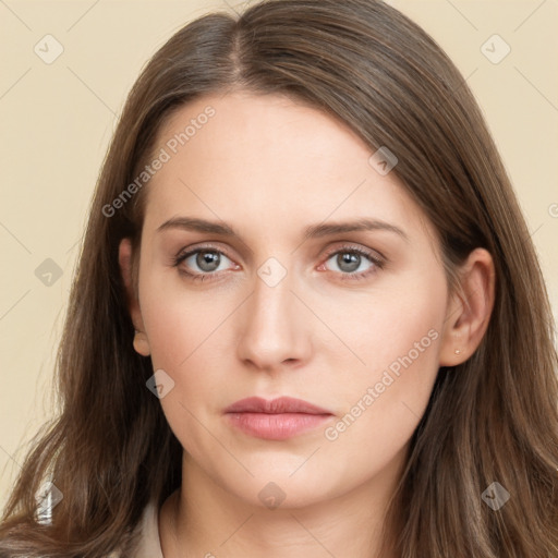 Neutral white young-adult female with long  brown hair and brown eyes