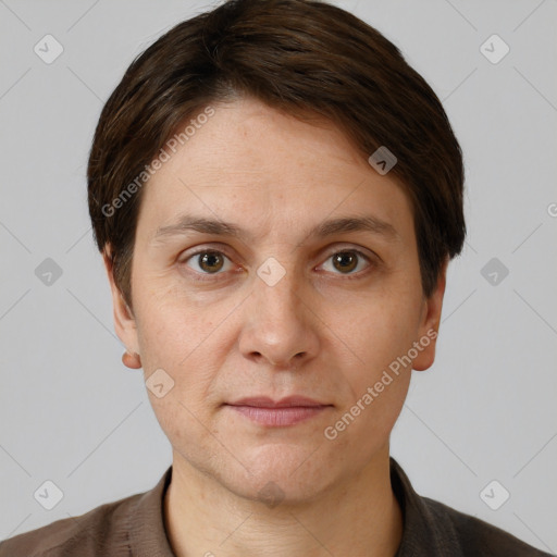 Joyful white adult female with short  brown hair and grey eyes