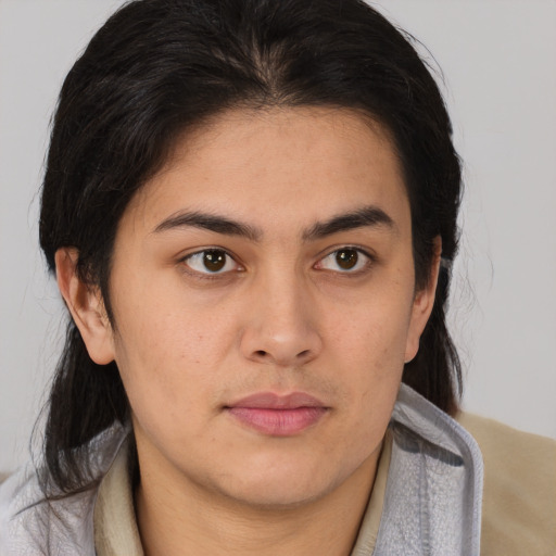 Neutral latino young-adult female with medium  brown hair and brown eyes