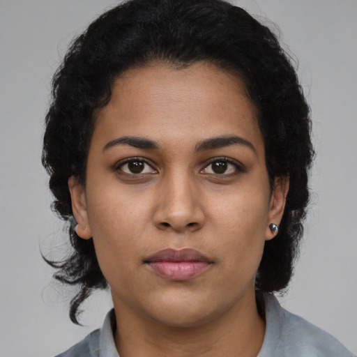Neutral latino young-adult female with medium  black hair and brown eyes