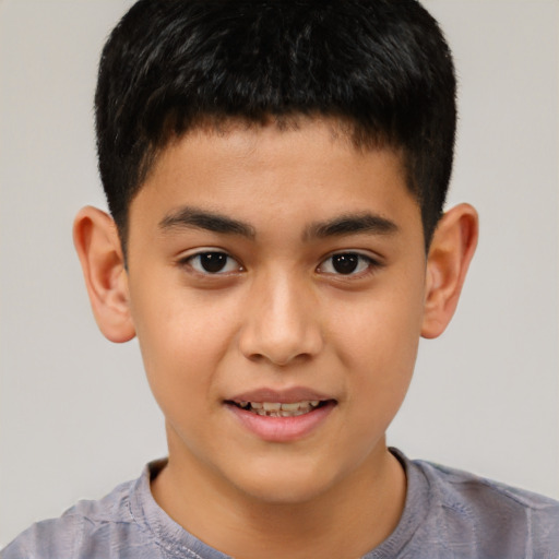 Joyful white child male with short  brown hair and brown eyes