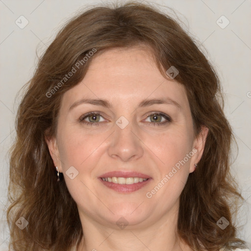 Joyful white adult female with medium  brown hair and green eyes