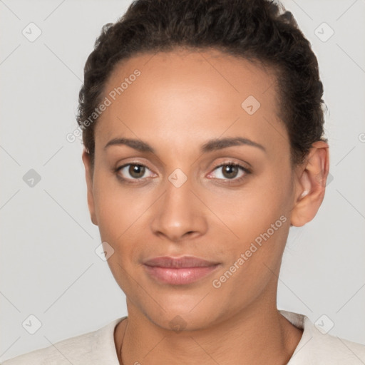 Joyful latino young-adult female with short  brown hair and brown eyes