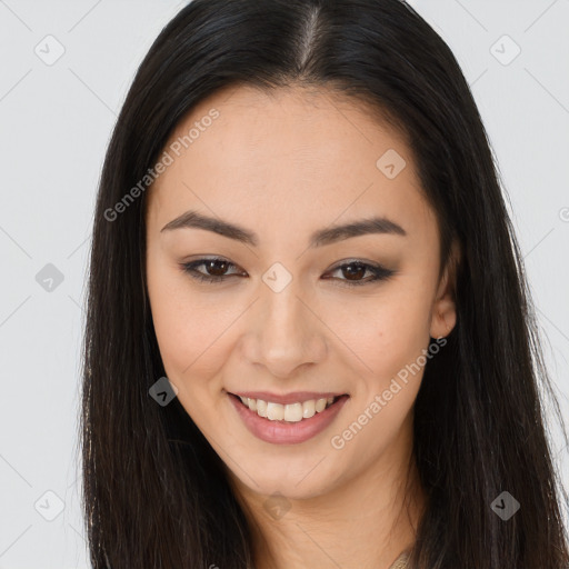 Joyful asian young-adult female with long  brown hair and brown eyes