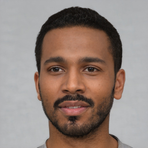 Neutral black young-adult male with short  black hair and brown eyes