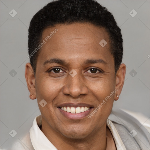 Joyful latino adult male with short  brown hair and brown eyes