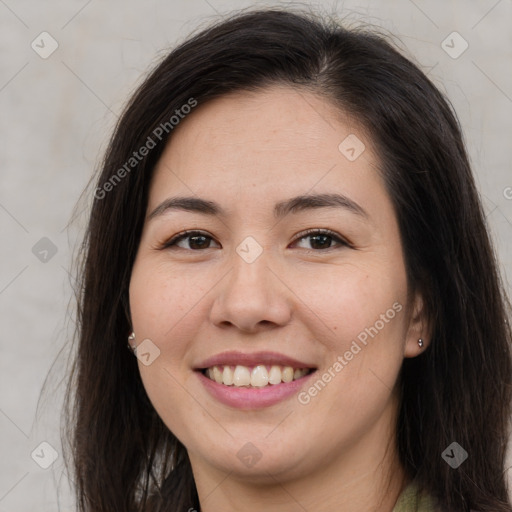 Joyful latino young-adult female with long  brown hair and brown eyes