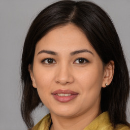 Joyful asian young-adult female with medium  brown hair and brown eyes