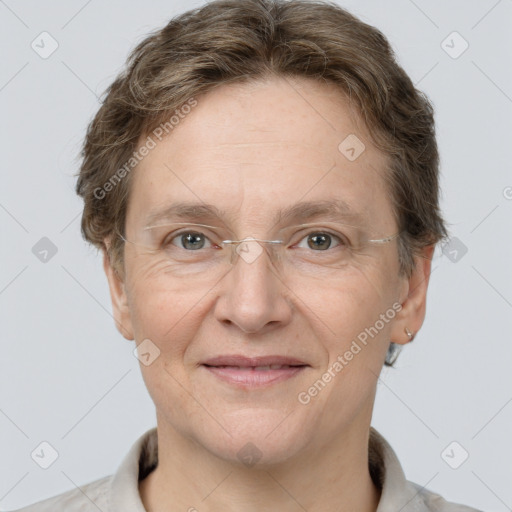 Joyful white adult female with short  brown hair and grey eyes