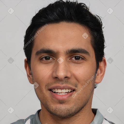 Joyful white young-adult male with short  black hair and brown eyes